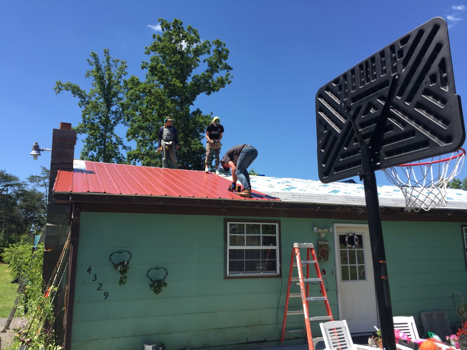 Installing the metal on Judy's roof